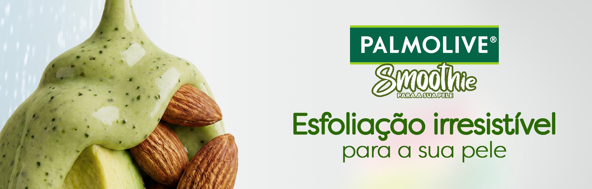 Esfoliante Palmolive Smoothie de amêndoa, abacate e leite sob a água, com partículas esfoliantes visíveis. Esfoliação irresistível para a sua pele.